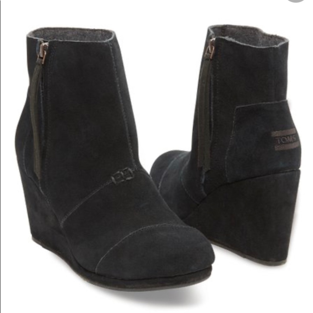 Tom’s black suede shoes